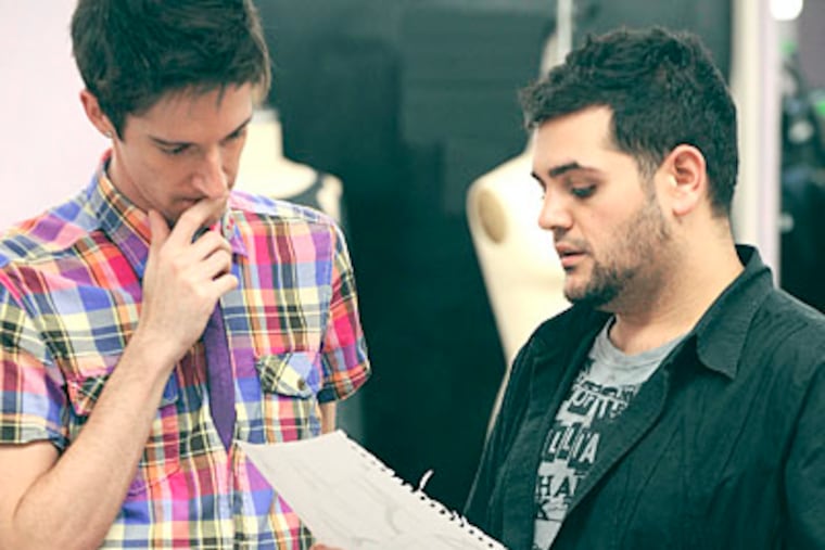 Michael Costello (right) works with ousted contested A.J. Thouvenot (left) in last week's episode of "Project Runway."