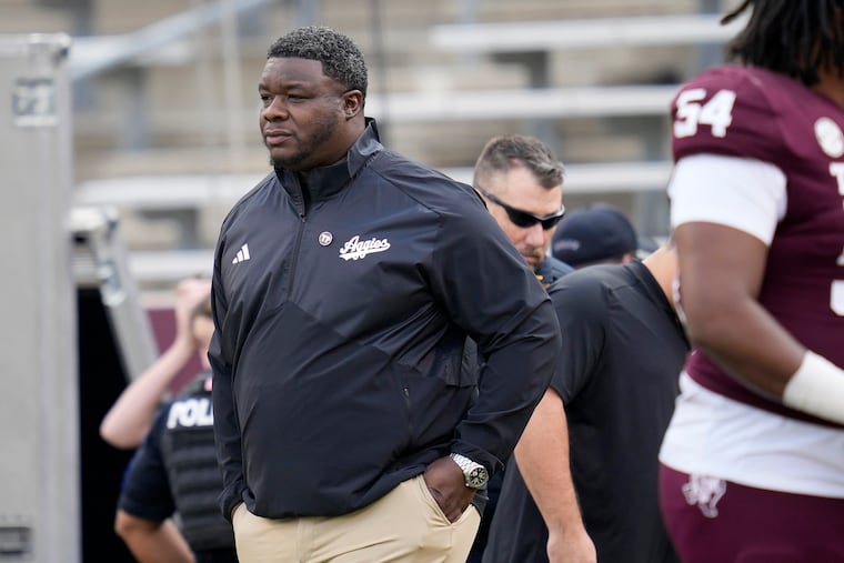 Texas A&M interim head coach Elijah Robinson takes the field for warmups of an NCAA college football game against Abilene Christian on Saturday, Nov. 18, 2023, in College Station, Texas. (AP Photo/Sam Craft)