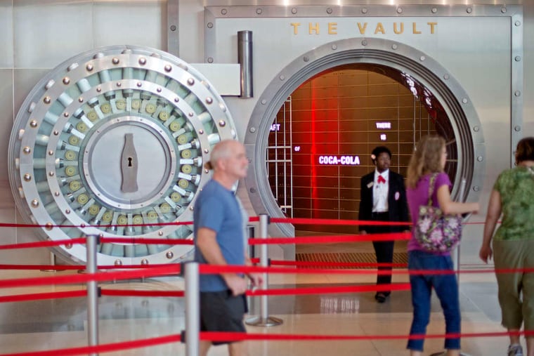 A tour group enters the steel vault exhibit containing the 127-year-old secret recipe at the World of Coca-Cola museum in Atlanta. The vault is monitored by security cameras. "It's a little bit for show," a guard admits.