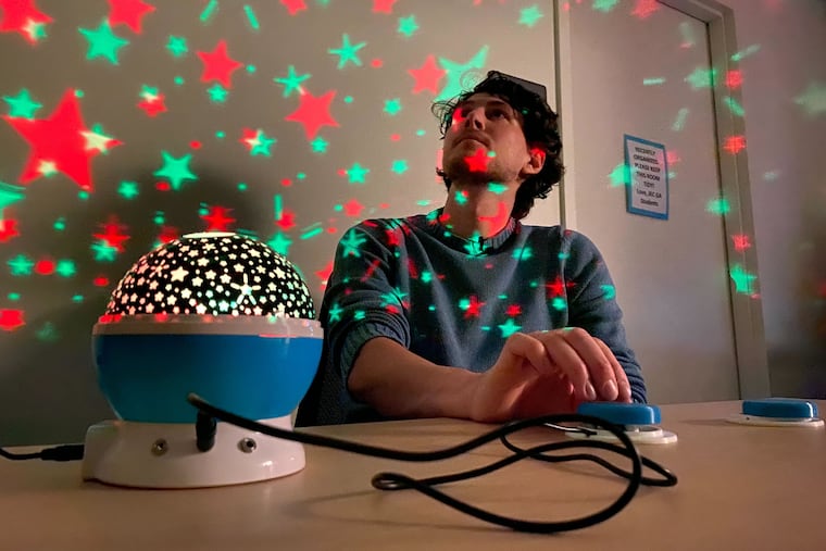 Zach Samalonis customized this toy lantern for children with disabilities by attaching the large blue button at right. An adjunct professor at Thomas Jefferson University, he taught occupational therapy students to do the same on Wednesday.