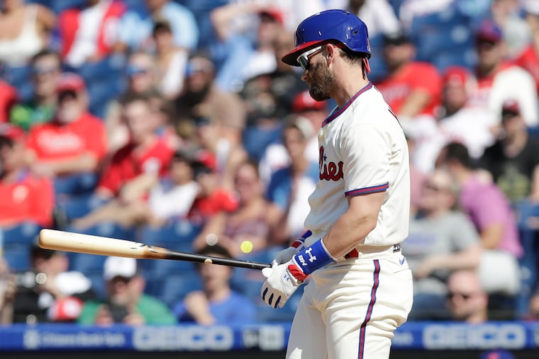 Phillies Bryce Harper looks at his bat after striking out to end the first inning against the Washington Nationals on Saturday, June 5, 2021. It was his first at-bat since returning from the injured list.