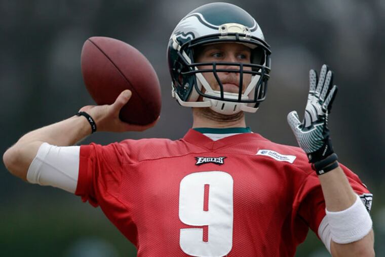 Eagles quarterback Nick Foles throws a pass during practice at the NFL football team's training facility, Thursday, Dec. 5, 2013, in Philadelphia. (AP Photo/Matt Rourke)