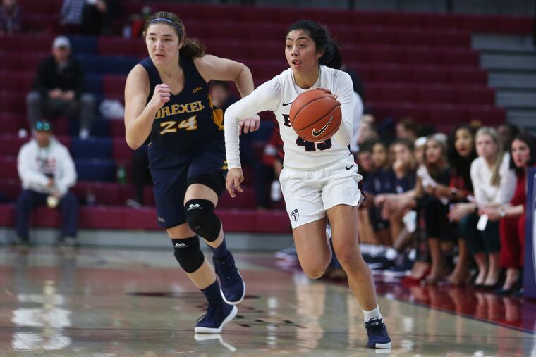 Penn women's basketball point guard Kayla Padilla (right) is averaging over 19 points per game this season.