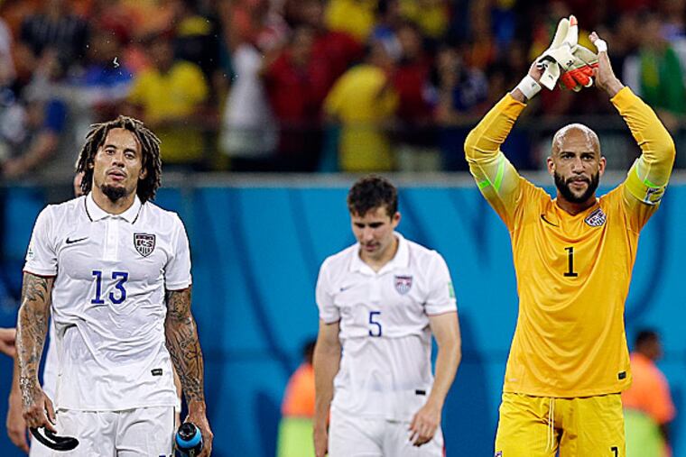 United States goalkeeper Tim Howard and Jermaine Jones walk off the pitch. (Martin Mejia/AP)