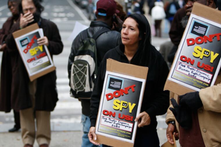 Cheri Honkala, National Organizer of Poor People's Economic Human Rights Campaign, protests outside City Hall on Wednesday. (David Maialetti / Staff Photographer)