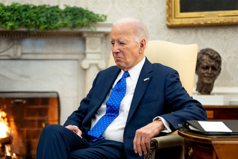 President Joe Biden sits in the Oval Office of the White House, Friday, Feb. 9, 2024, in Washington.