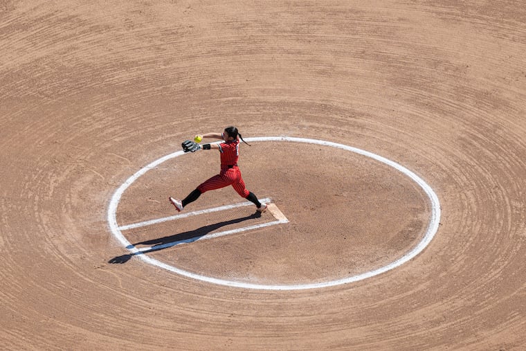 Rutgers Camden pitcher Natalie D’Angelo delivers from the mound during a game against Stockton in Camden, N.J.