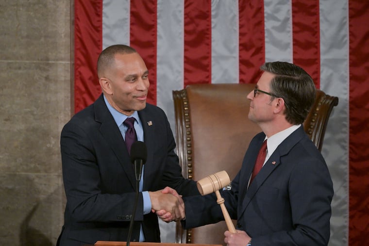 House Minority Leader Hakeem Jeffries, left, hands the gavel to newly reelected House Speaker Mike Johnson on Jan. 3, 2025.