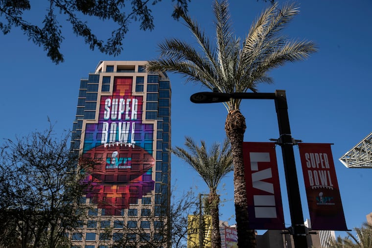 Ads decorate buildings and lamp posts before the Super Bowl in Phoenix.