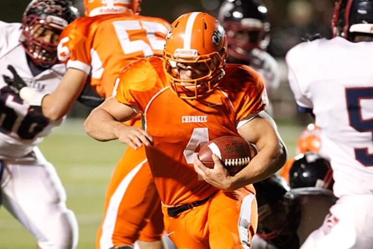 Cherokee Matthew Stickney rambles for a sizable gain. (Ron Cortes/Staff Photographer)