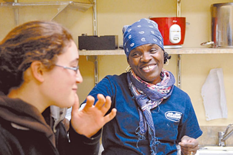 Learning for Life partners Shelly Mattison, right, and Becca Krantz cook together. (Tom Gralish/Staff)