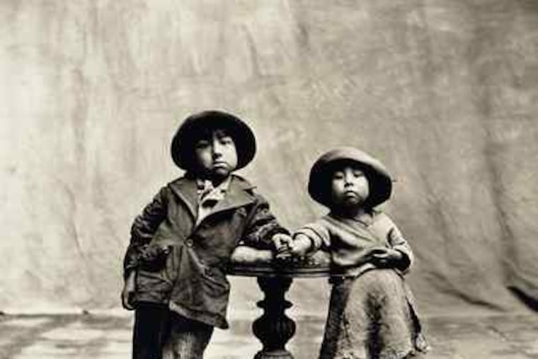 A 1948 image of two Peruvian children reflects Irving Penn's reaching far afield from fashion. See more of his work at the National Gallery of Art's site via http://go.philly.com/irvingpenn.