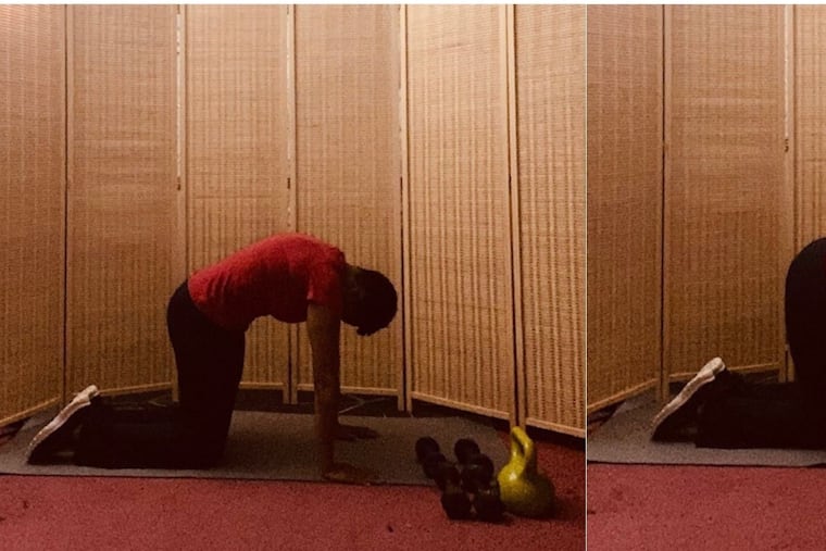 Demonstrating the cat-cow pose.