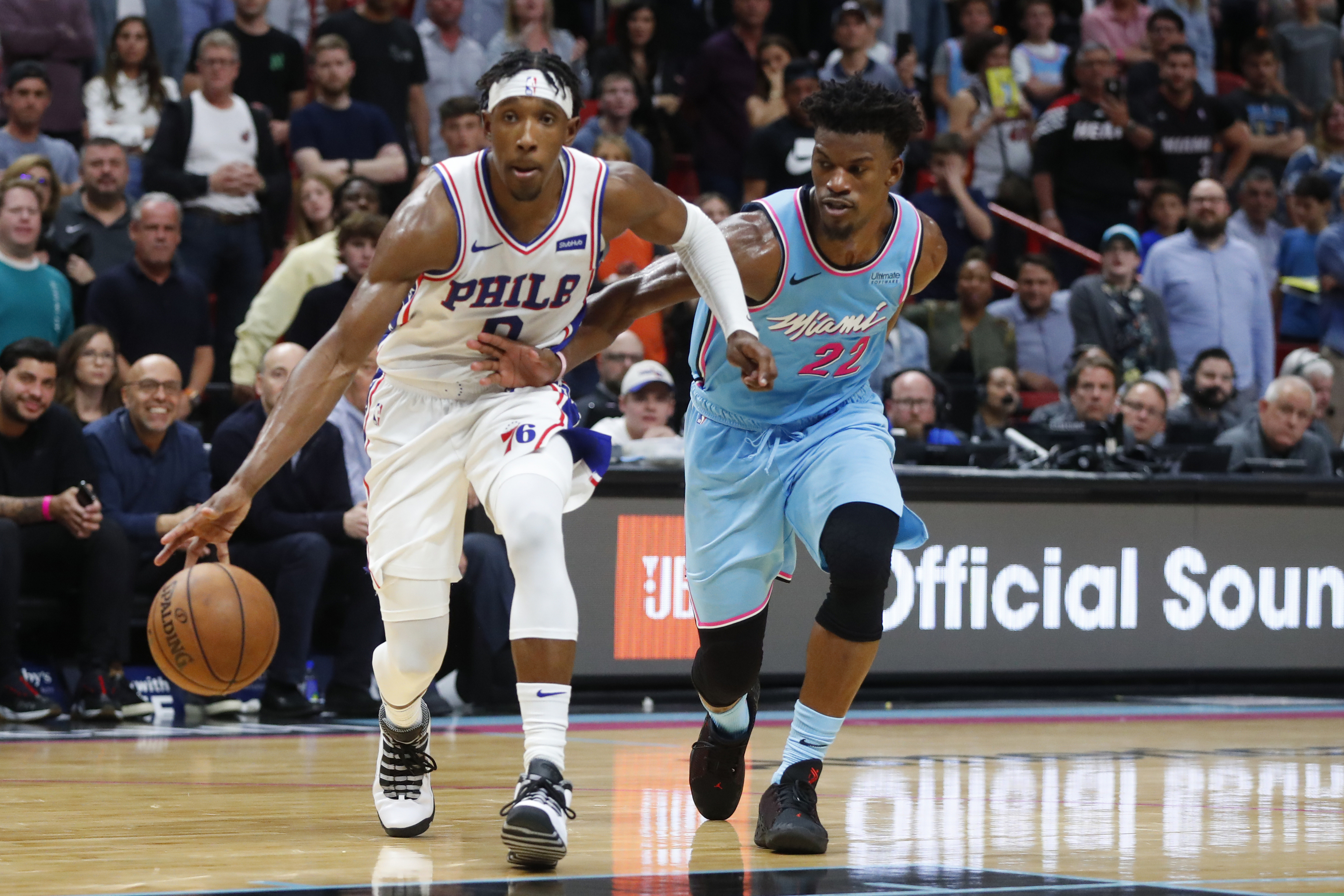 Sixers guard Josh Richardson (0) driving to the basket against Heat forward Jimmy Butler (22) during Saturday's game.