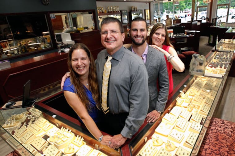 Angelo Breaux at Family & Co. Jewelers with children Jessica (left), Angelo Jr., and Crystal Barket. Breaux raised his children on the family enterprise from a young age. (MICHAEL BRYANT/Staff Photographer)