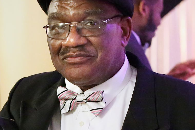 School police officer Kenneth Washington at Strawberry Mansion High School's prom in 2019. Mr. Washington died March 18 of COVID-19.