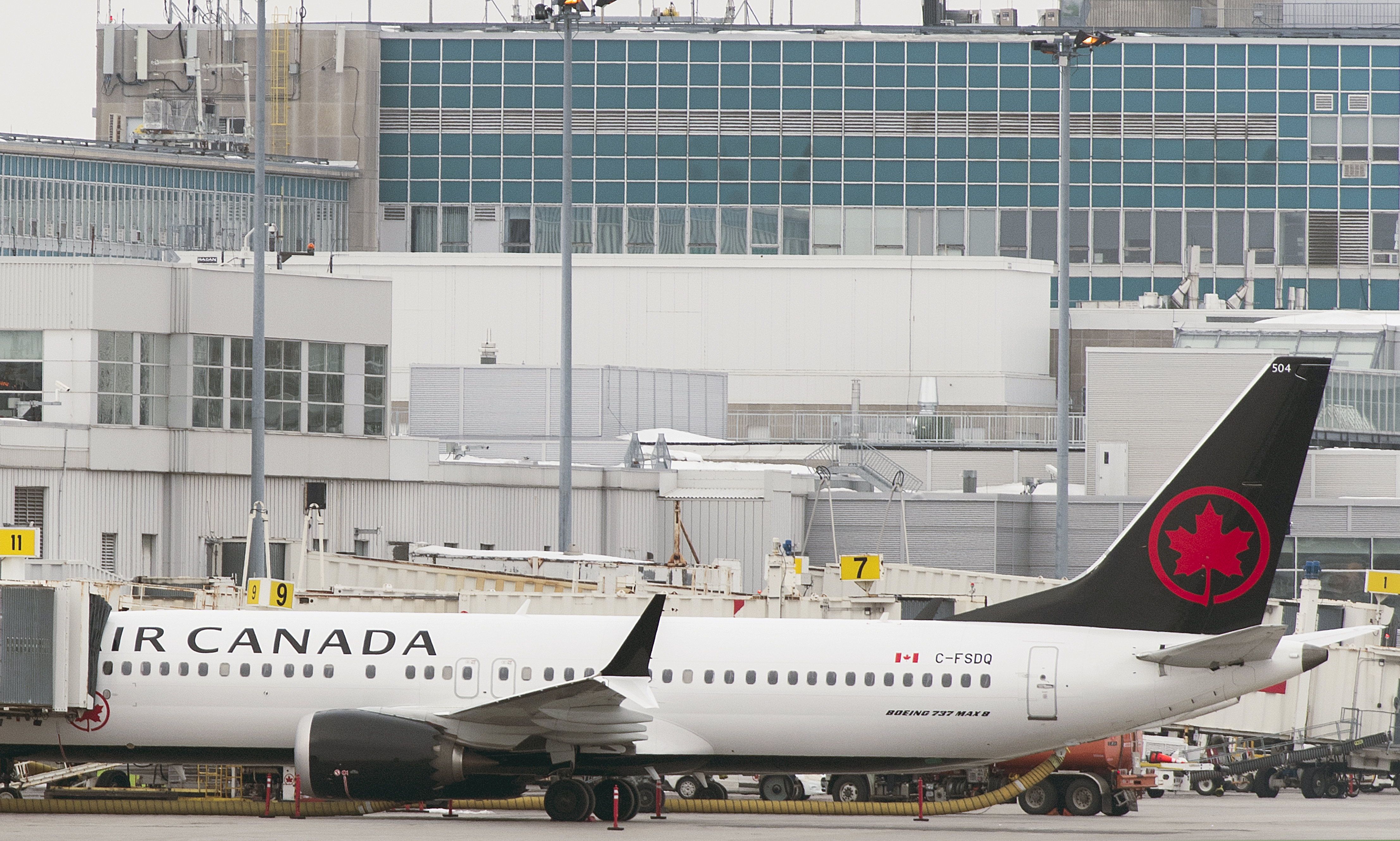An Air Canada Boeing 737 Max 8 aircraft is parked next to a gate at Trudeau Airport in Montreal, Wednesday, March 13, 2019. (Graham Hughes/The Canadian Press via AP)