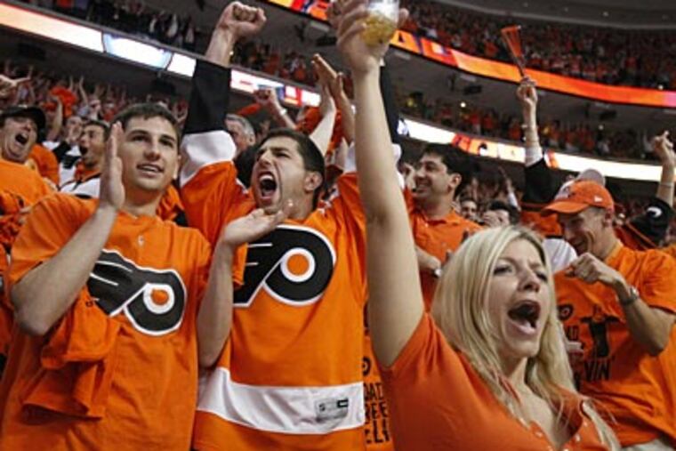 Fans celebrate during Game 3 of the Stanley Cup Finals. The Flyers won, 4-3, in overtime. (Ron Cortes / Staff Photographer)