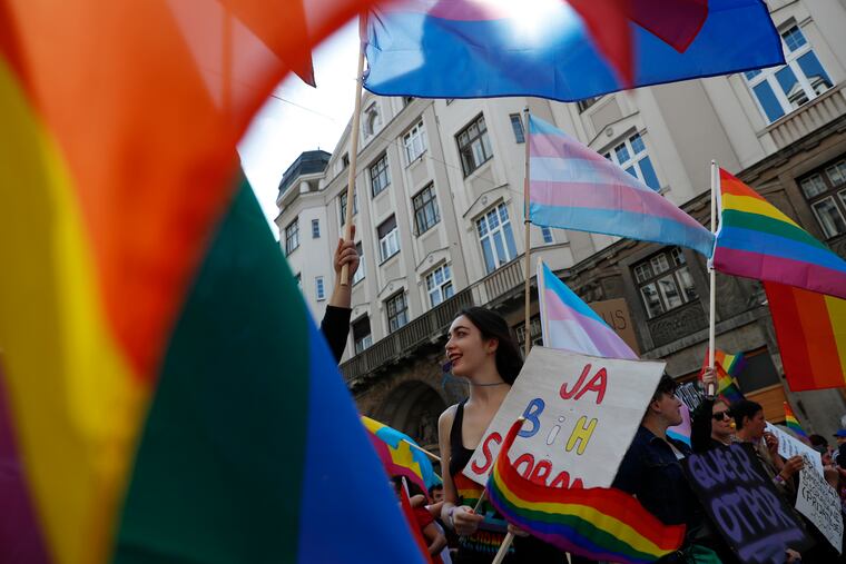 Participant blows a whistle during the country's first ever LGBT pride parade in downtown Sarajevo, Bosnia-Herzegovina, Sunday, Sept. 8, 2019. Sarajevo is the last capital city in the Balkans to hold a pride parade after neighboring countries moved to improve LGBT rights. (AP Photo/Darko Bandic)