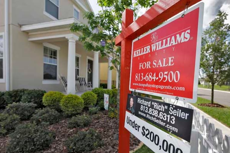 FILE - In this May 14, 2014 file photo, a sign hangs in front of a new home for sale in Riverview, Fla. Sales of new U.S. homes plunged in June, the Commerce Department said Thursday, July 24, 2014, a sign that real estate continues to be a weak spot in the economy. (AP Photo/Chris O'Meara, File)