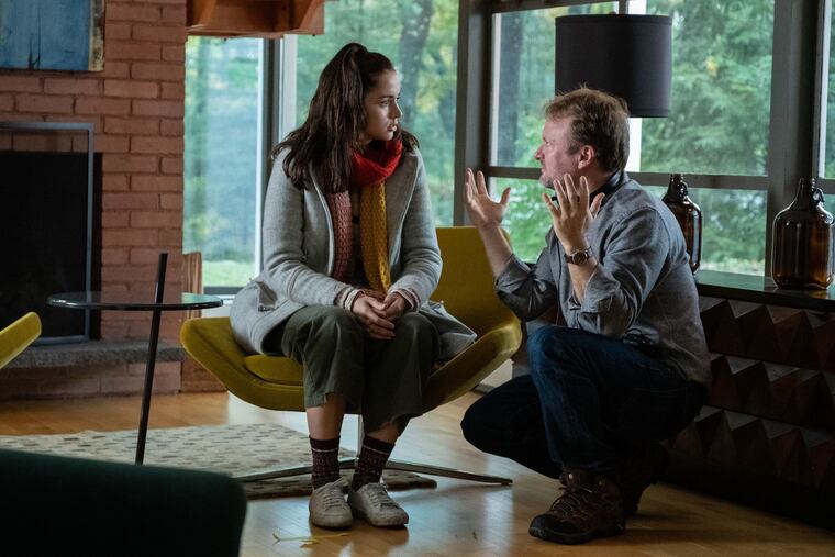 Director Rian Johnson talks to actor Ana de Armas on the set of "Knives Out."