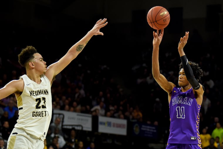 Roman Catholic's Justice Williams (right) shoots in front of Neumann Goretti's Jordan Hall (left) in the first half of Philadelphia Catholic League boys’ basketball championship game at the Palestra Feb. 24, 2020. .