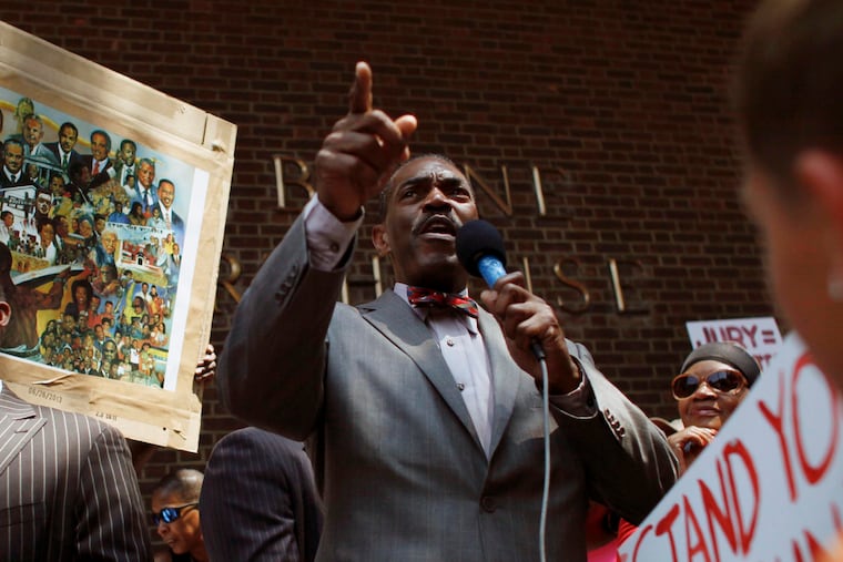 Minister Rodney Muhammad speaks to the crowd during a 2013 "Justice for Trayvon" in Philadelphia. Pennsylvania's governor and attorney general joined the growing number of calls Tuesday, July 28, 2020 for Muhammad, who is Philadelphia's NAACP president, to resign after he posted an anti-Semitic meme to social media the previous week.