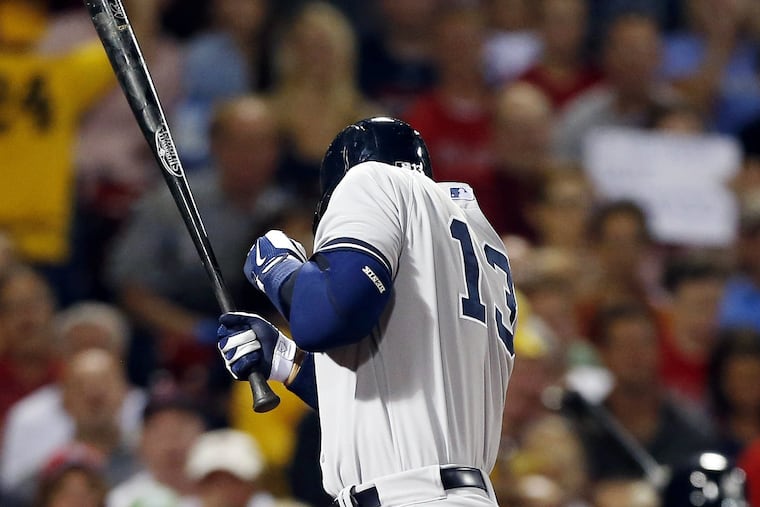 Alex Rodriguez ducks as he is hit by a pitch from Red Sox's Ryan Dempster.