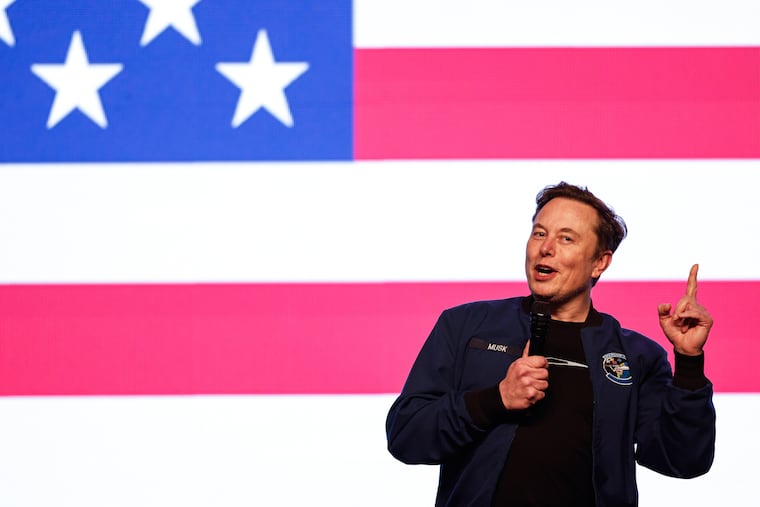 Elon Musk speaks at a town hall in Green Bay, Wis.