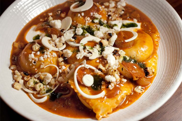 It's good old Cope's corn - in ravioli! The dried corn is pureed like polenta, the pillows nestle in Mexican chorizo sauce.