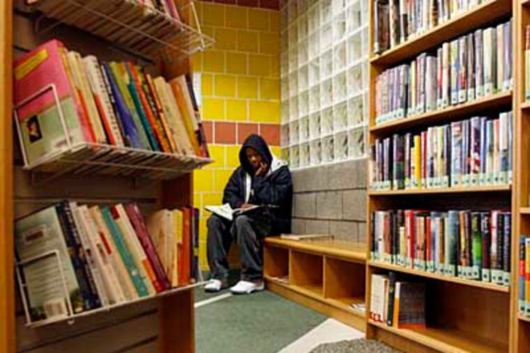 Damarkus Clark, 14, loves to read. He lives minutes from the library and spends time after school and on half-days reading there. The Fumo Family Branch of the Philadelphia Public Libraries will stay open. The branch was one of eleven to close tomorrow, Thursday, Dec. 31 ( Bonnie Weller / Staff ) PLib31-A. South Phila. Broad Street.