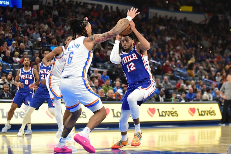 Tobias Harris (12) drives past Oklahoma City Thunder forward Jaylin Williams (6) in the first half on Nov. 25 in Oklahoma City.