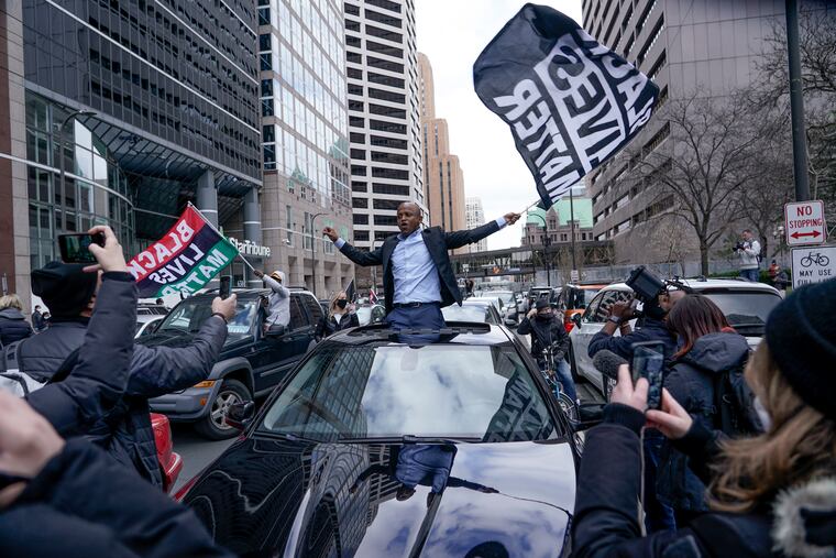 People rally outside the courthouse in Minneapolis on Tuesday, April 20, 2021, after the guilty verdicts were announced in the trial of former Minneapolis police officer Derek Chauvin in the death of George Floyd. (AP Photo/Morry Gash)