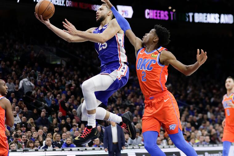 Sixers guard Ben Simmons drives to the basket past Thunder guard Shai Gilgeous-Alexander on Monday.