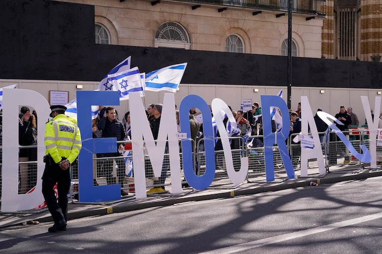 Protesters demand democracy during a March visit by Israeli Prime Minister Benjamin Netanyahu to 10 Downing St. in London.