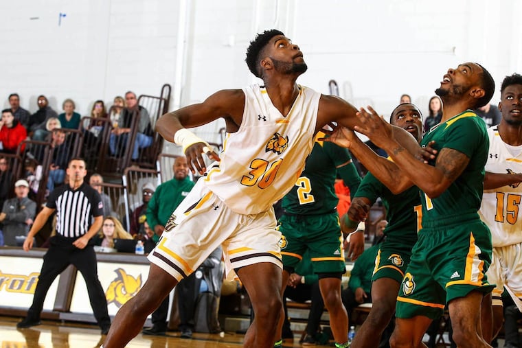 Diante Bah (middle) showed up at an open tryout for the Rowan University basketball team having never played the game in high school or college, and not only made the team, but now is a big reason for the team's success.