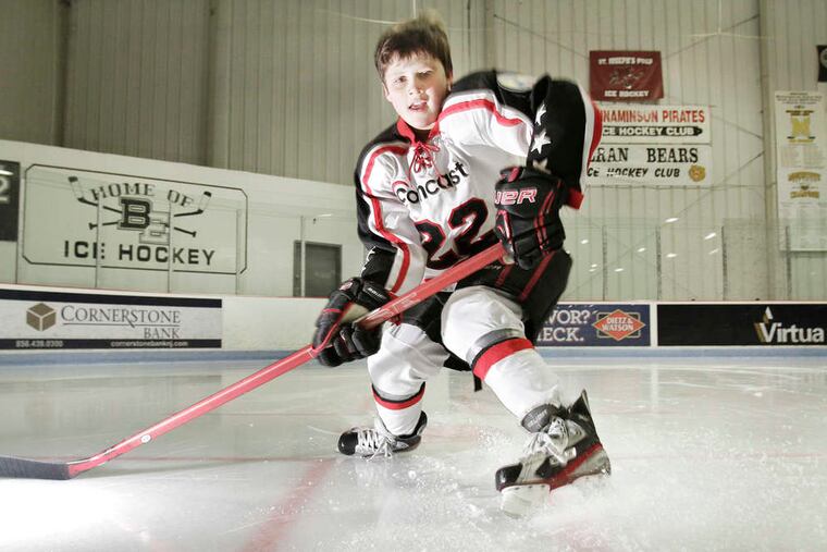 Austin Cook before a hockey practice at the Flyers Skate Zone in Pennsauken this month.