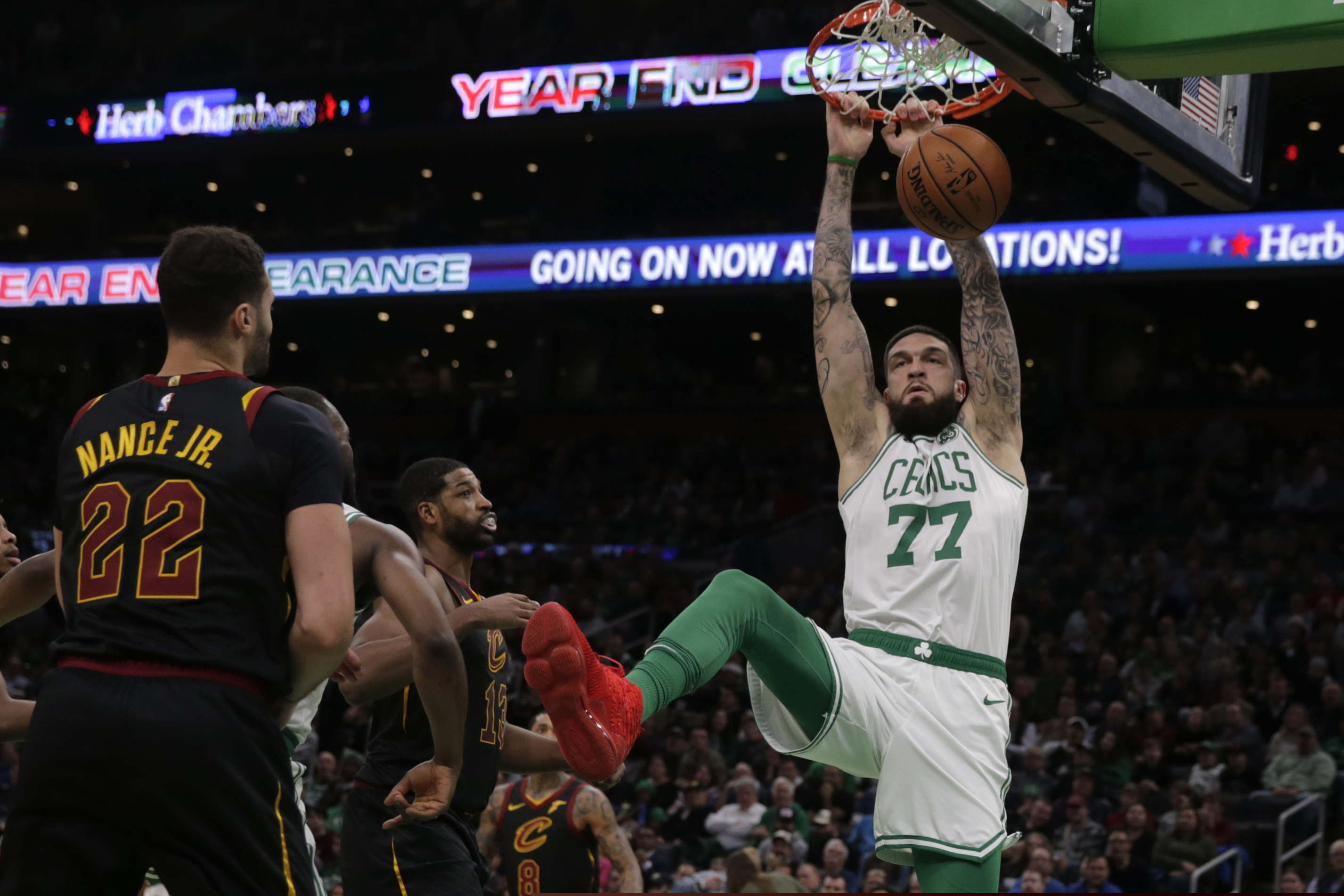 Center Vincent Poirier (77) slams a dunk during the second half of an NBA basketball game against the Cleveland Cavaliers on Dec. 9, 2019. The Celtics won 110-88.