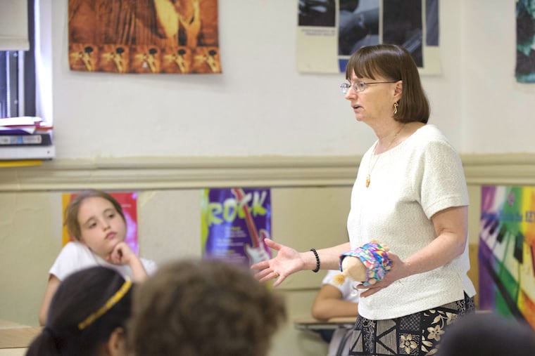 Teacher Lisa Hantman talks to her third-graders about practicing kindness before they begin a music lesson at Gen. George A. McCall School.