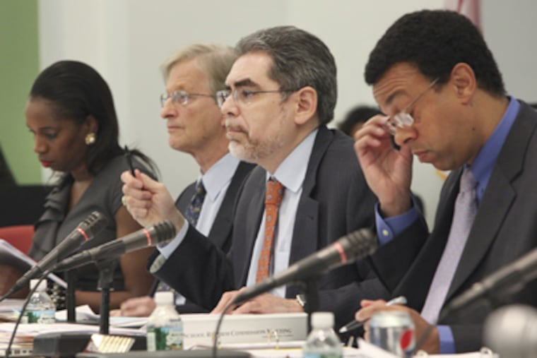 SRC Chairman Pedro Ramos, center, during the meeting, Thursday, April 19. ( Steven M. Falk / Staff Photographer )