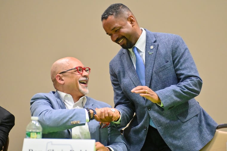 State Rep. Chris Rabb and State Sen. Sharif Street shake hands after participating in the debate for Pennsylvania’s 3rd Congressional District at Center in the Park in Germantown on Tuesday, April 14, 2026.