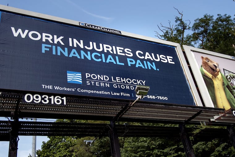 A billboard for Pond Lehocky Stern Giordano viewed from northbound South 26th Street, between Penrose Avenue and 1-76.