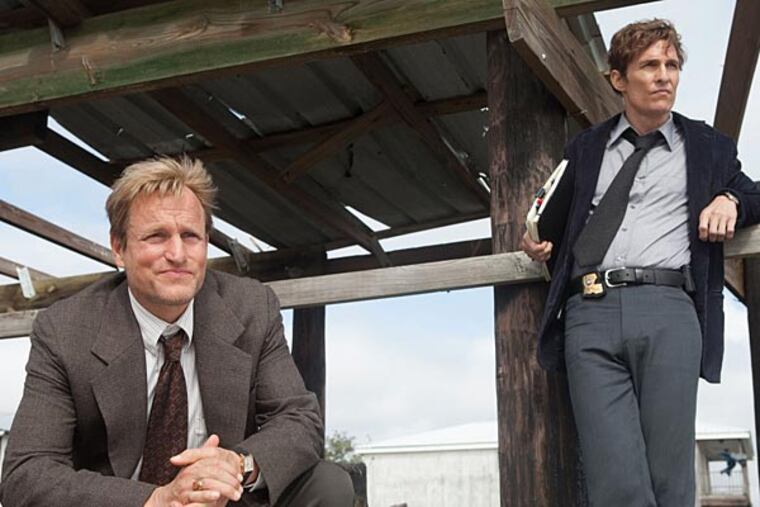Woody Harrelson(seated left) as Detective Martin Hart and Matthew McConaughey (right)as his partner Det. Rust Cohle lead the cast of HBO'sTrueDetective created and by novelist Nic Pizzolatto.