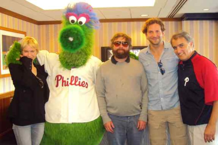 Renee Zellweger at Sunday's Phillies game with Zach Galifianakis (center), Bradley Cooper, and the team's John Brazer.