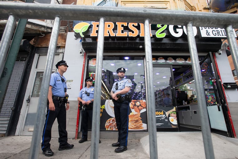 Police patrol on South Street on June 11, a week after a mass shooting took place on the popular Philadelphia street.
