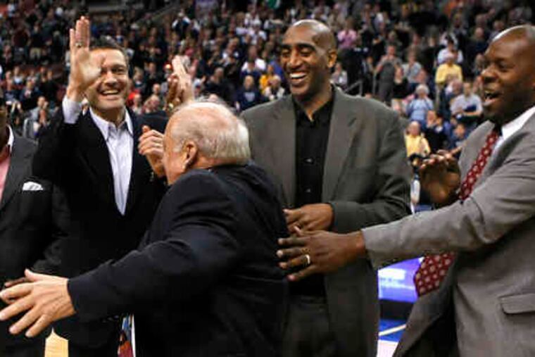 Former Villanova coach Rollie Massimino is greeted by (from left) Gary McLain, Harold Jensen, Harold Pressley, and Dwayne McClain, all key players on the 1985 championship squad.