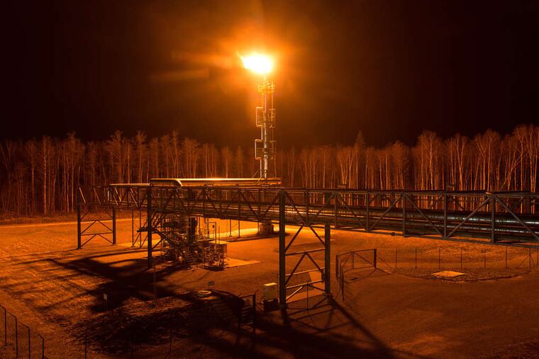A gas flare illuminates the forest at Eesti Energia AS's Enefit 280 oil shale processing plant and energy production facility in Narva, Estonia. Eesti Energia is one of the world's largest oil shale energy companies with an annual production of around 1.3 million barrels of shale oil. Shale oil from places such as Pennsylvania is revolutionizing the world's energy industries. PETER KOLLANYI / Bloomberg