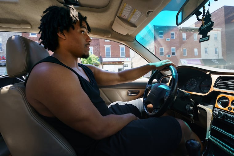 David Cabello, the founder and owner of Black and Mobile, an online food delivery service that delivers exclusively for Black-owned restaurants, driving to deliver food in Philly.