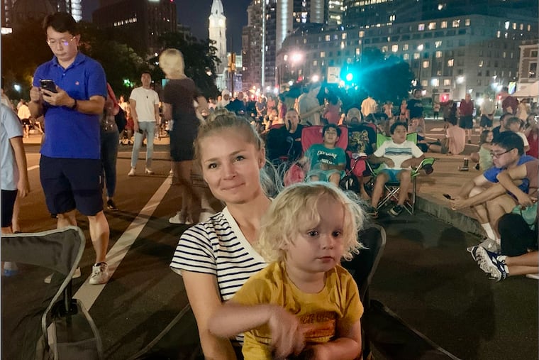 Zoe Bouchelle with her son on the Parkway on July Fourth, just before gunshots rang out. After they fled and got home, her son asked if they could “be safe again when the sun comes up.”