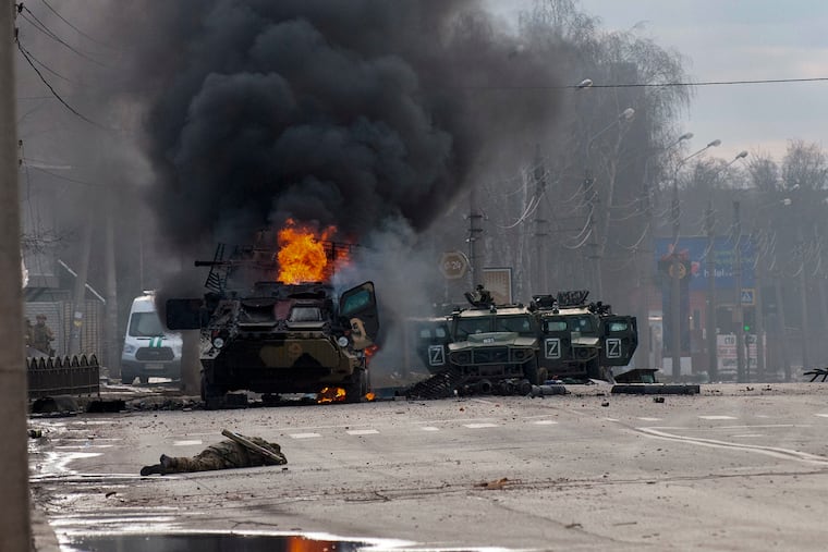 A Russian armored personnel carrier burning amid damaged and abandoned light utility vehicles after fighting in Kharkiv, Ukraine, on Sunday.
